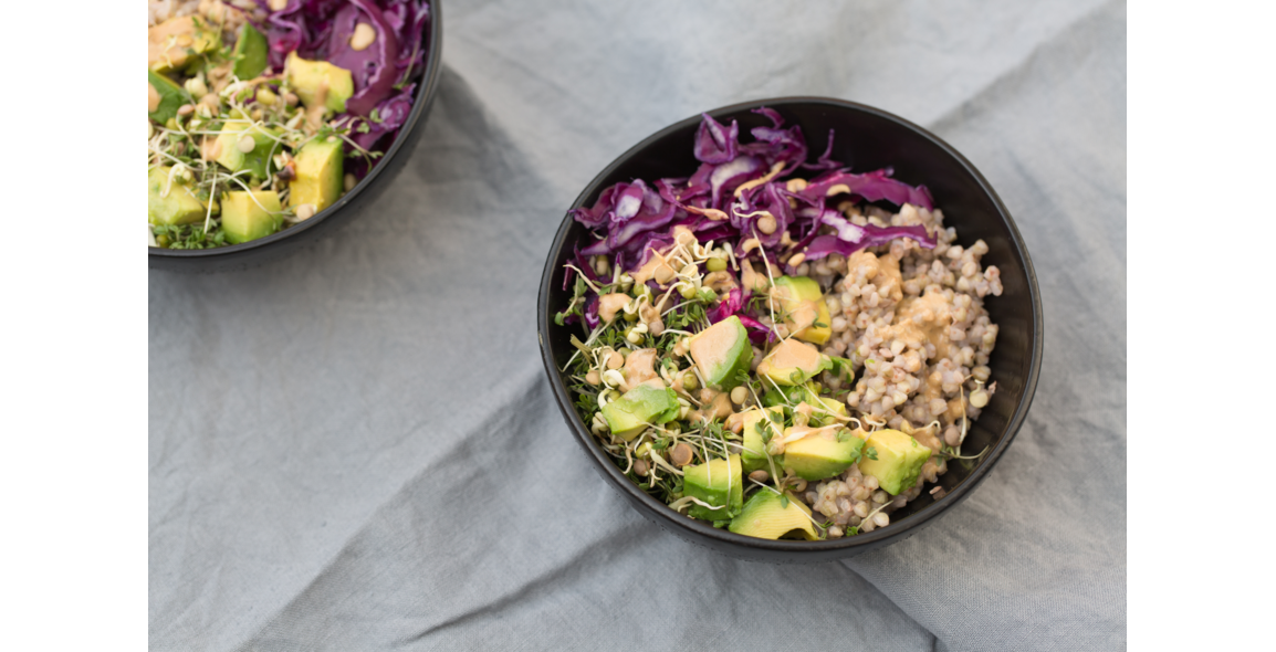 Buckwheat buddha bowl with avocado, red kale and tahini dressing