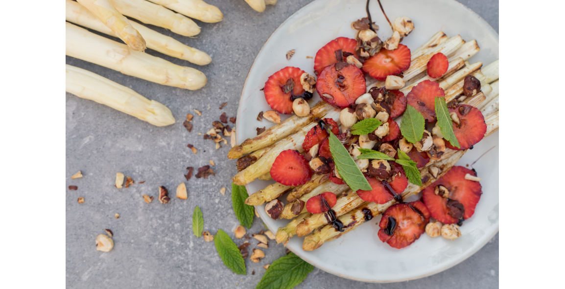 Roasted white asparagus with strawberries, caramelized hazelnuts and a balsamic reduction