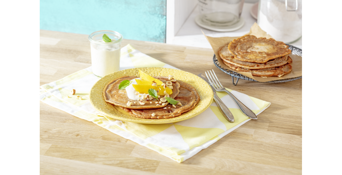 Walnut pancakes with mango & quark cream