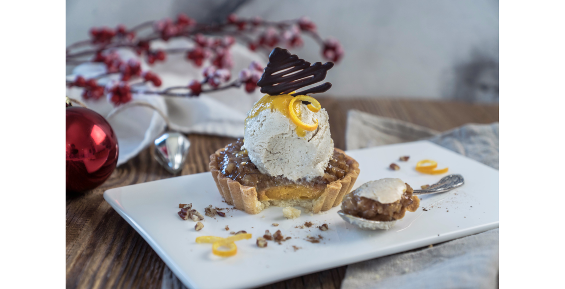 Pecan pie with spicy Christmas cookie ice cream and amaretto sauce