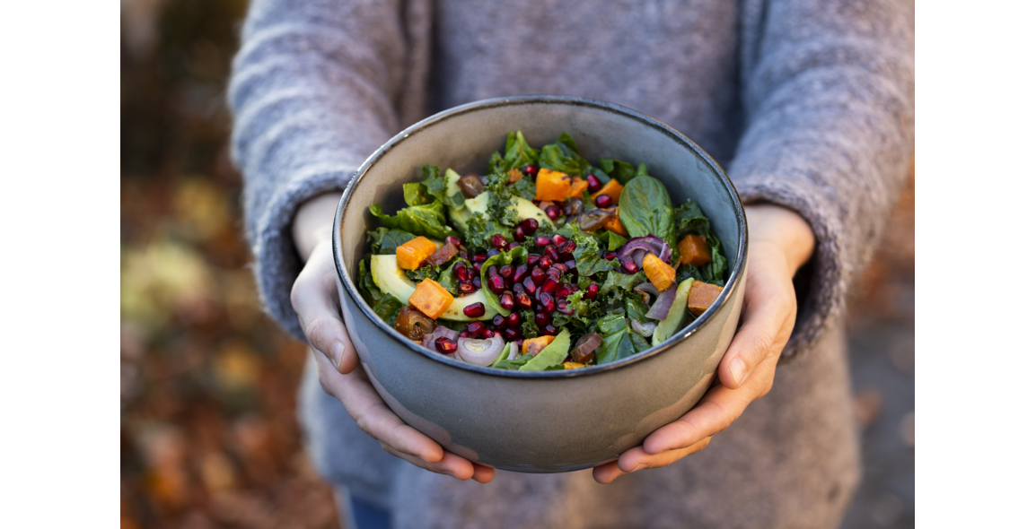 Kale salad with avocado, sweet potatoes and pomegranate