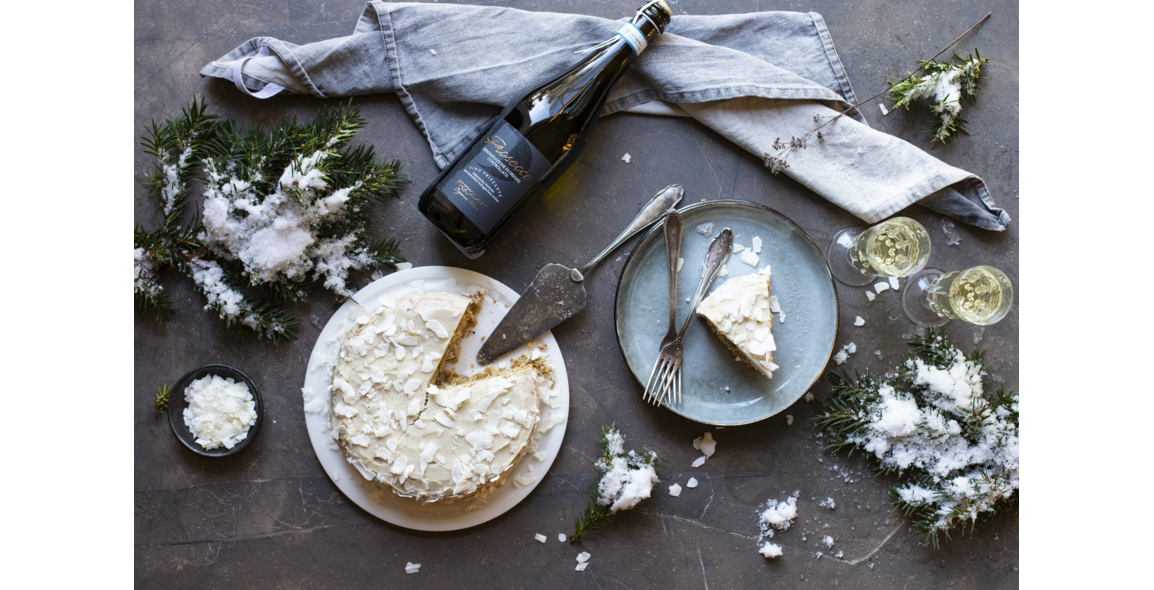 Coconut cake with coconut flakes and a coconut-almond cream