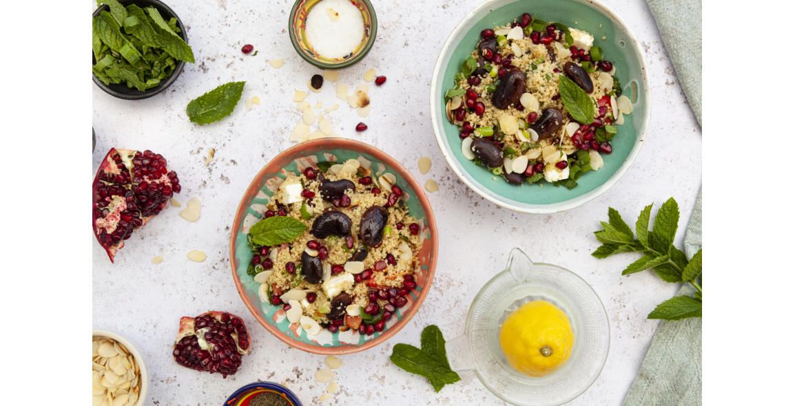Couscous salad with colored giant beans and pomegranate
