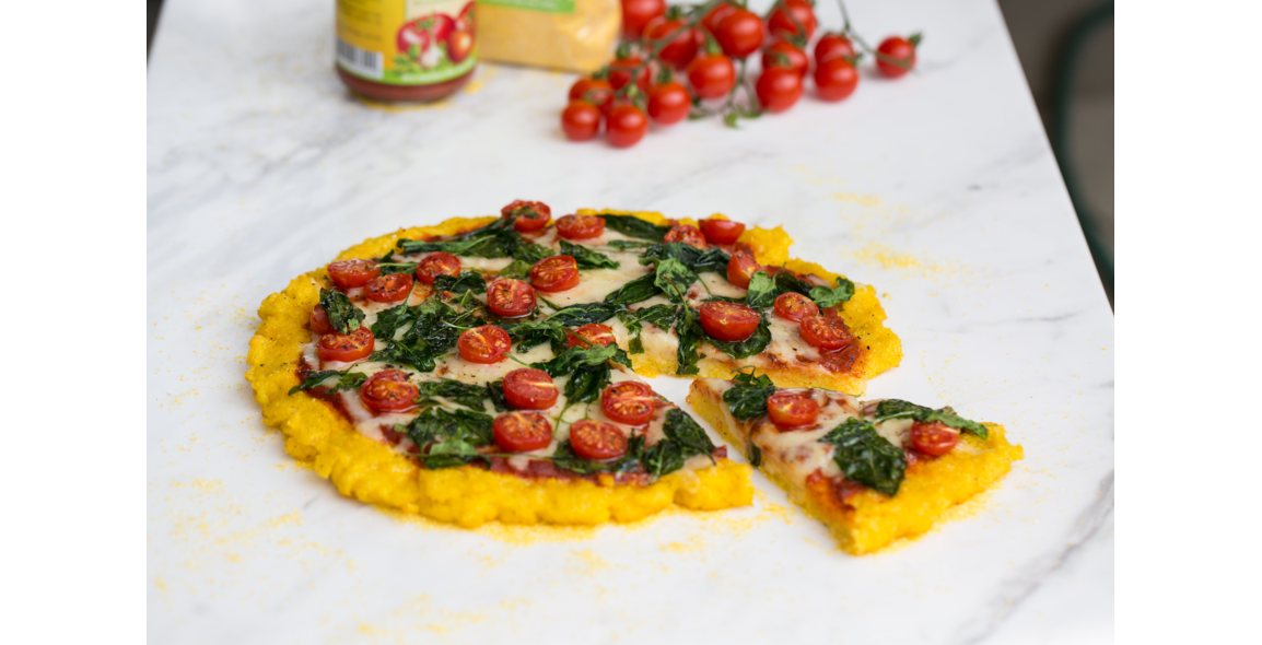 Polenta pizza with spinach and cherry tomatoes