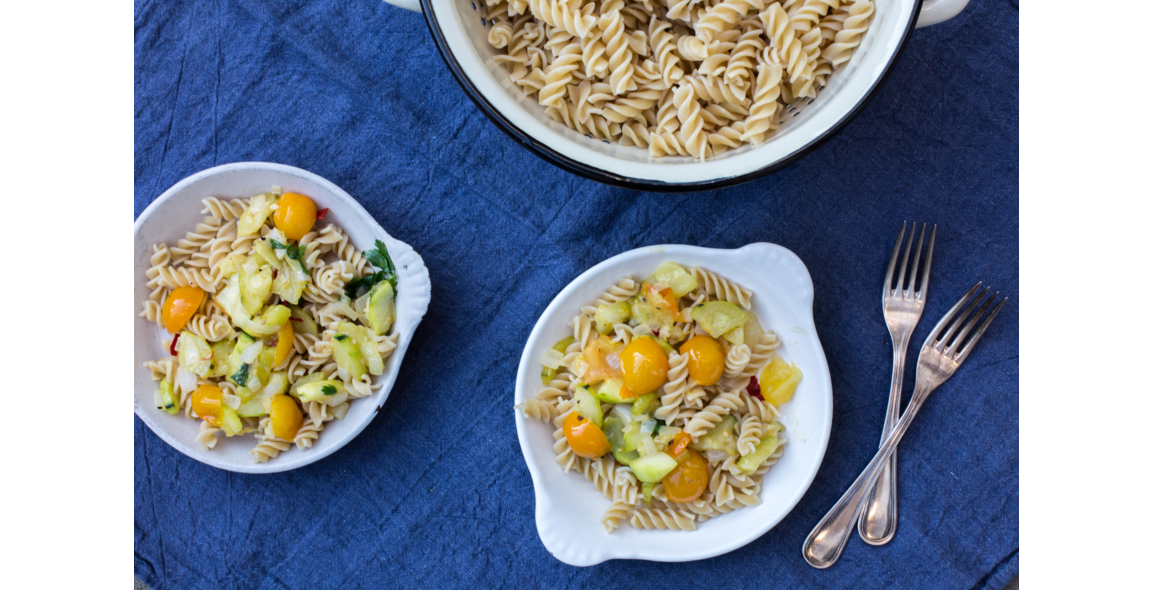 Spirelli with yellow cherry tomatoes, zucchini and fresh parsley