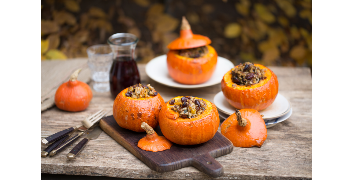 Roasted pumpkins stuffed with wild rice, pecan nuts and cranberries